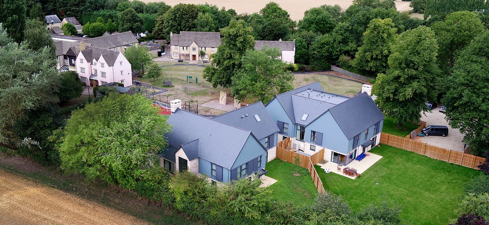 Aerial view of Mulberry Bush School buildings and landscaped grounds in Standlake.