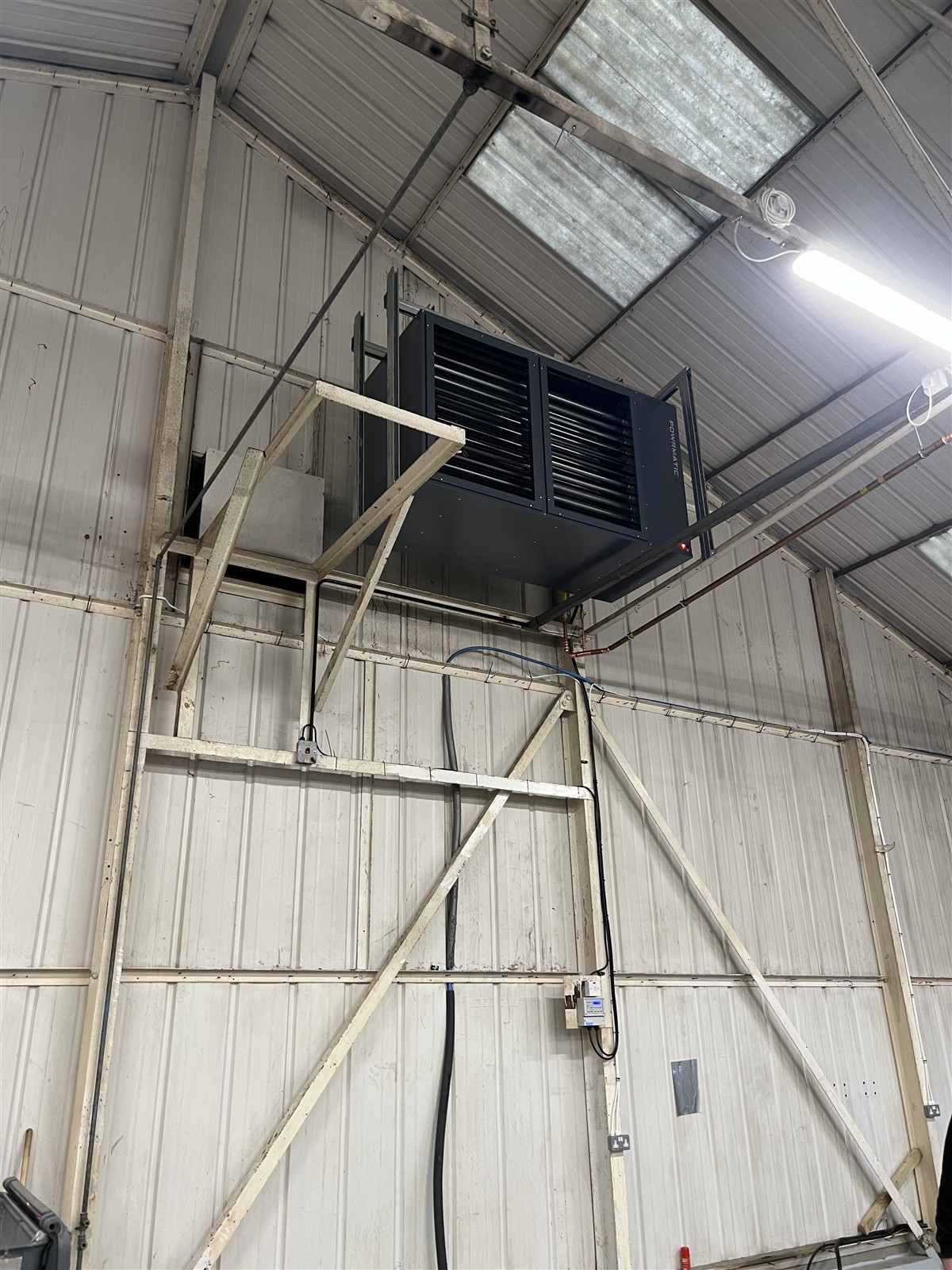 Powrmatic warm-air heater installed high in the MediaFleet workshop