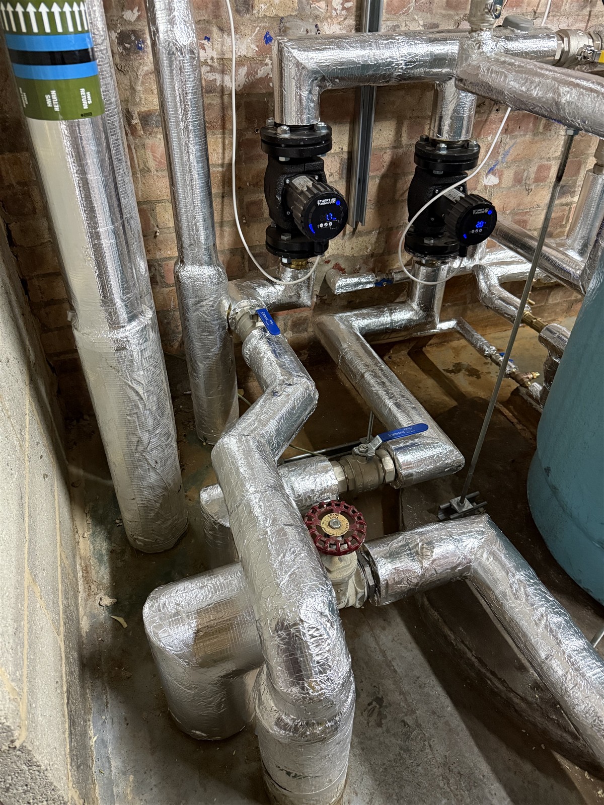 Circulation pumps and insulated pipework at Mulberry Bush School