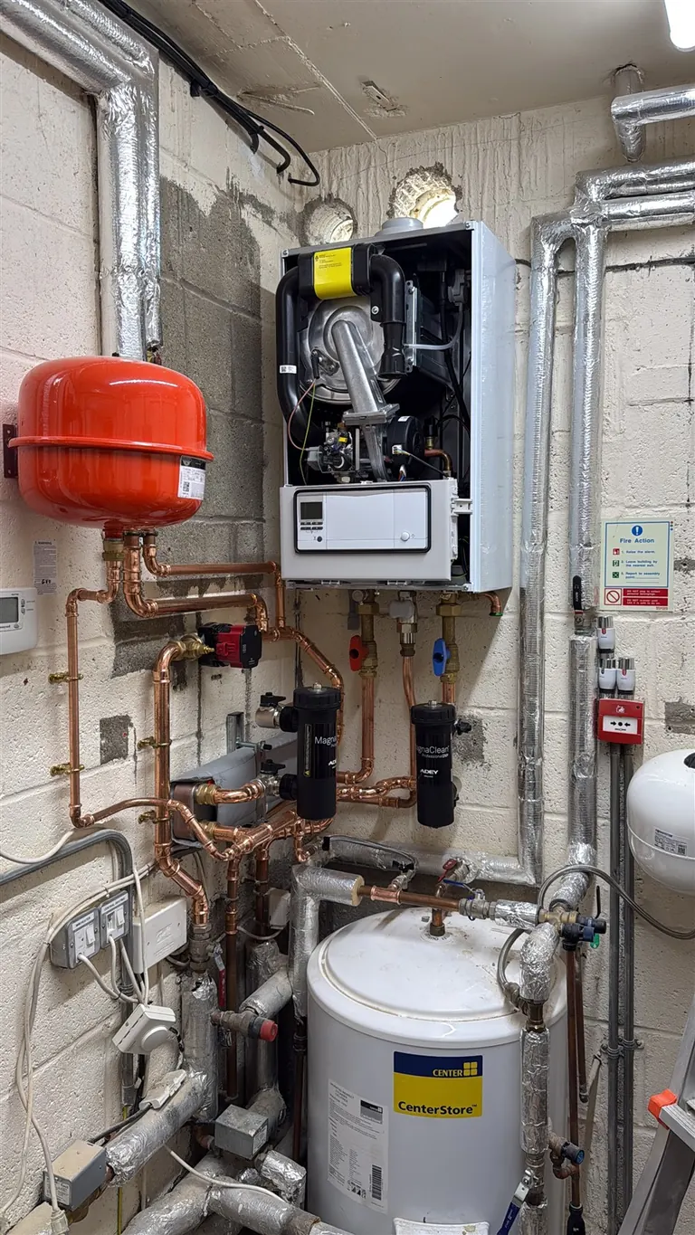 Vaillant ecoTEC plus 48 kW boiler with its front casing removed during commissioning