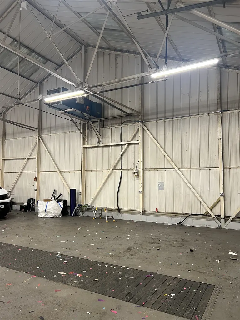 Existing high-level warm-air heater position and services at the MediaFleet warehouse