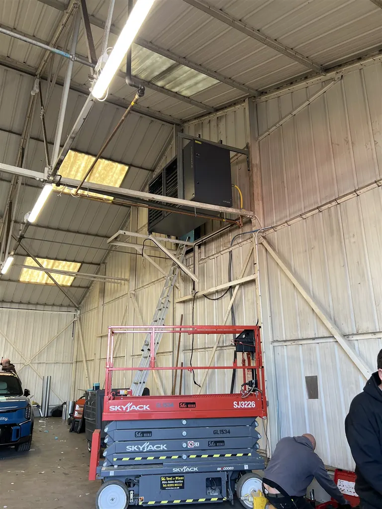 High-level Powrmatic heater installation in progress at MediaFleet