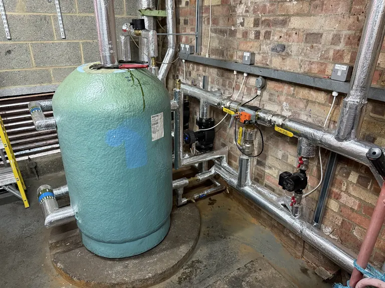 Telford cylinder with insulated pipework circulation pumps and controls