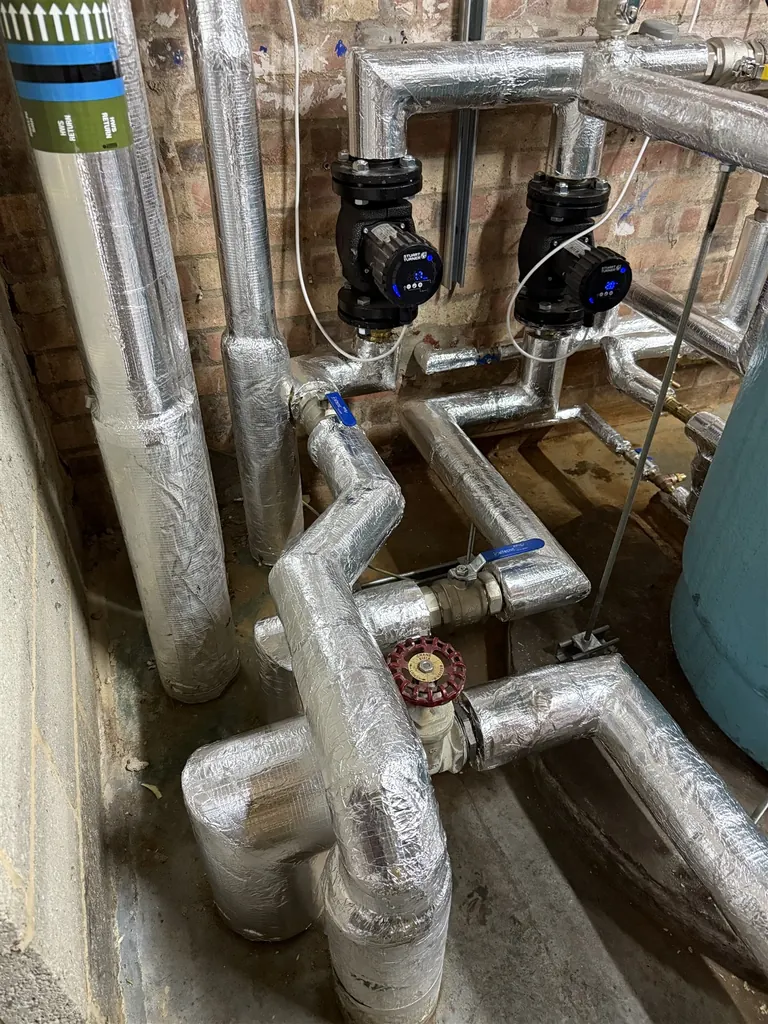 Circulation pumps and insulated pipework at Mulberry Bush School