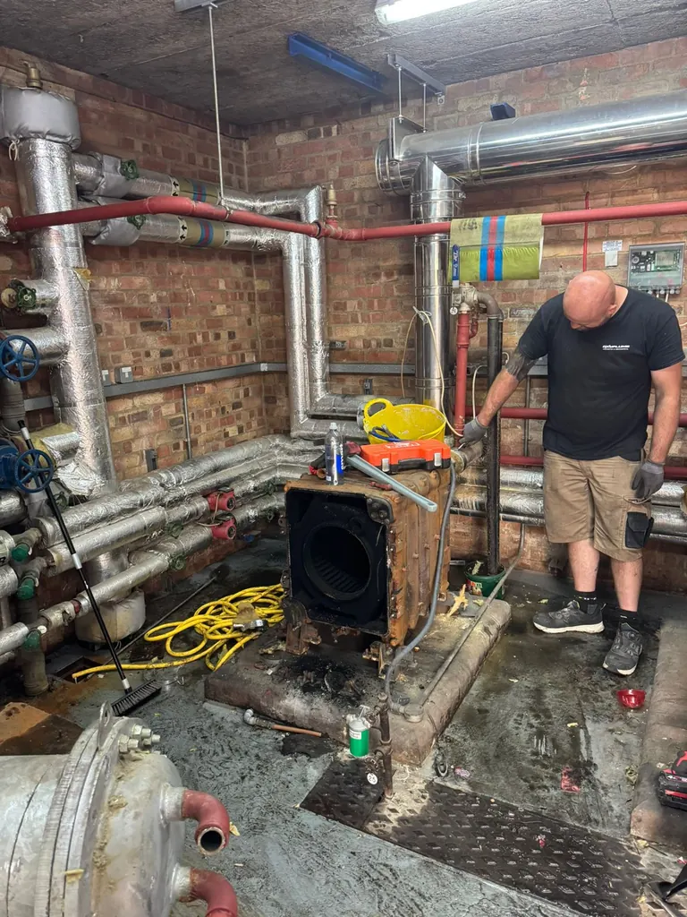 Old plant-room equipment being removed at Mulberry Bush School