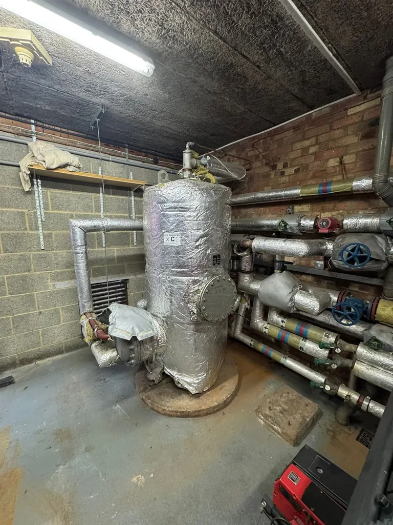 Original 700-litre calorifier and insulated services at Mulberry Bush School