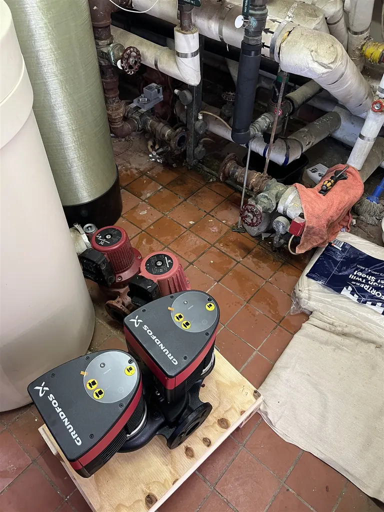 Two replacement Grundfos MAGNA1 D 50-120 F twin-head circulation pumps ready for installation