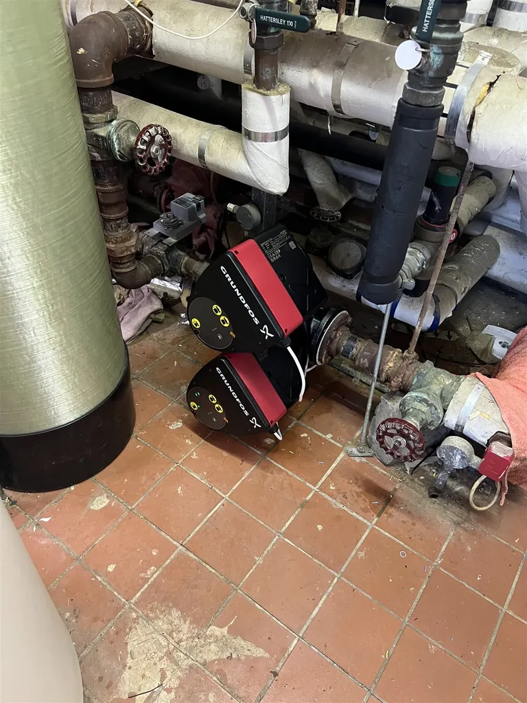 New Grundfos twin-head circulation pumps fitted into the existing nursing-home heating pipework