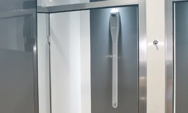 Rada silver shower panels within individual commercial shower cubicles