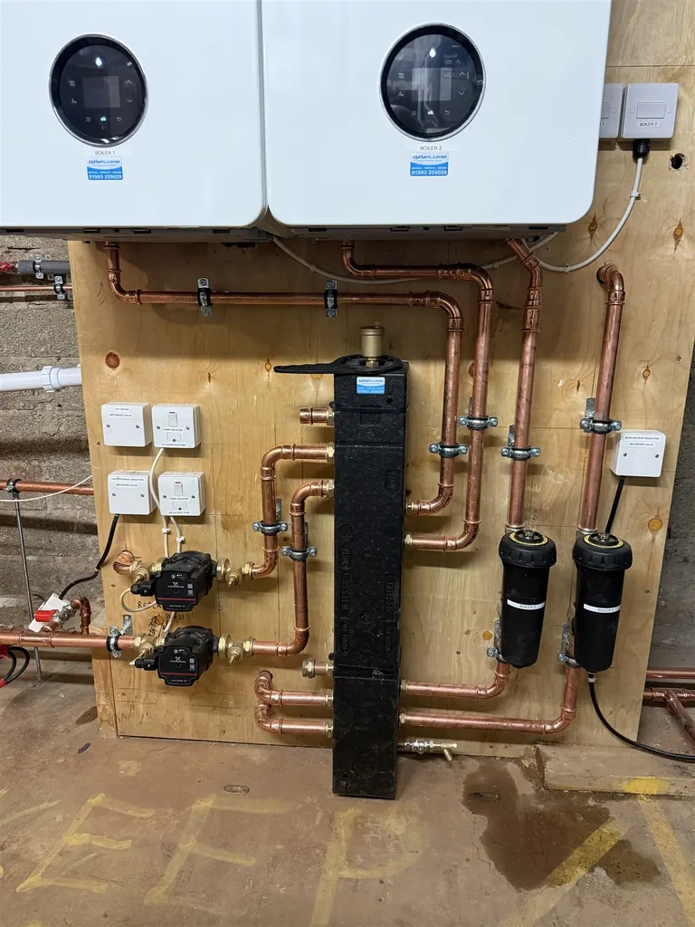 Grundfos pumps Greenstar filters and low-loss header beneath the boilers at the museum