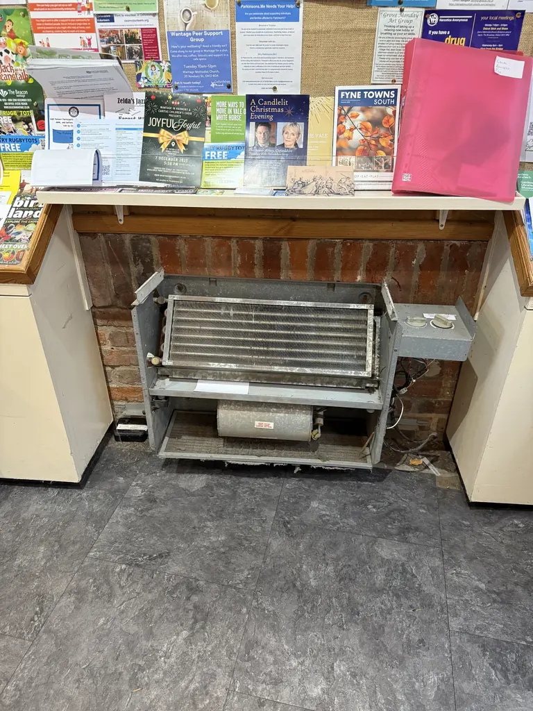 Old room convector heater opened for inspection at the Vale and Downland Museum