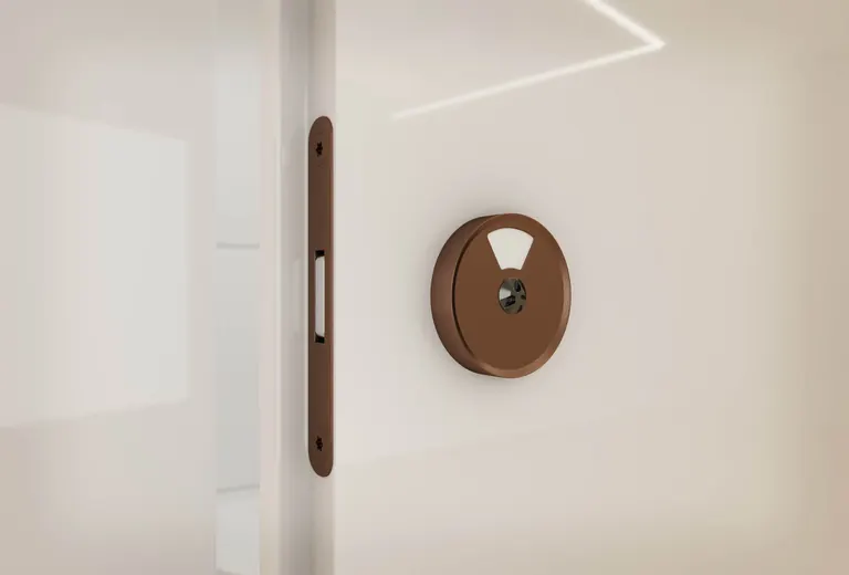Bronze indicator lock and pale full-height door in the Venesta Infinite range